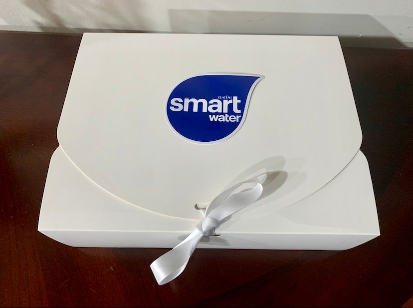 Influencer kit box packaging with Smartwater logo on top.